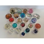 a colle4ction of glass paperweights