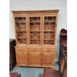 Pine dresser W144cm x H202cm with astral glazed panels and cupboards belowCondition