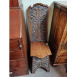 Carved oak hall chair marked 1904Condition StatusCondition Grade:  B Good: In good condition but
