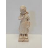 Marble figure of girl holding shoes