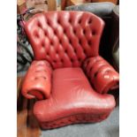 Orange leather chesterfield armchairCondition StatusCondition Grade:  C Fair: In fair condition