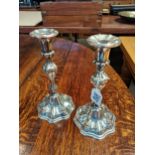 A Pair of silver plated candlesticks