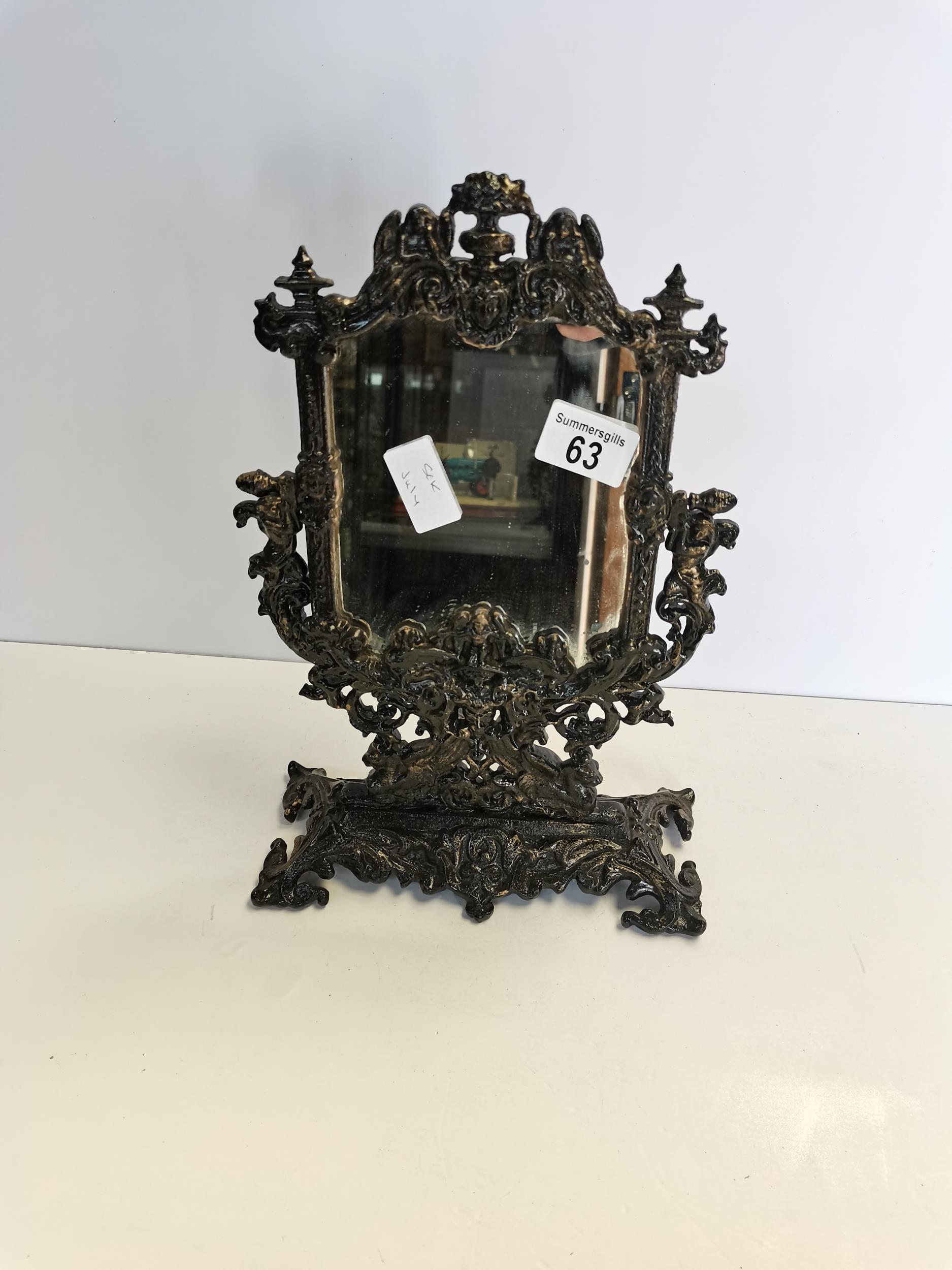 Cast iron face mirror