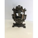 Cast iron face mirror