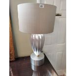 A pair of top quality silver table lamps 80cm high