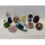 A collection of glass paperweights and glass dish