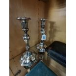A pair of silver plated candle sticks