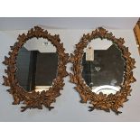 Pair of cast iron Ivy & Berry leaf patterned Mirrors with registration mark on the back