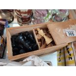 wooden chess pieces in box