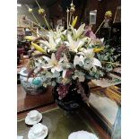 A pair of 1m high artificial flower displays