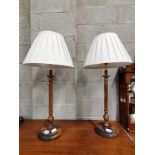 A Pair of table lamps with wood base