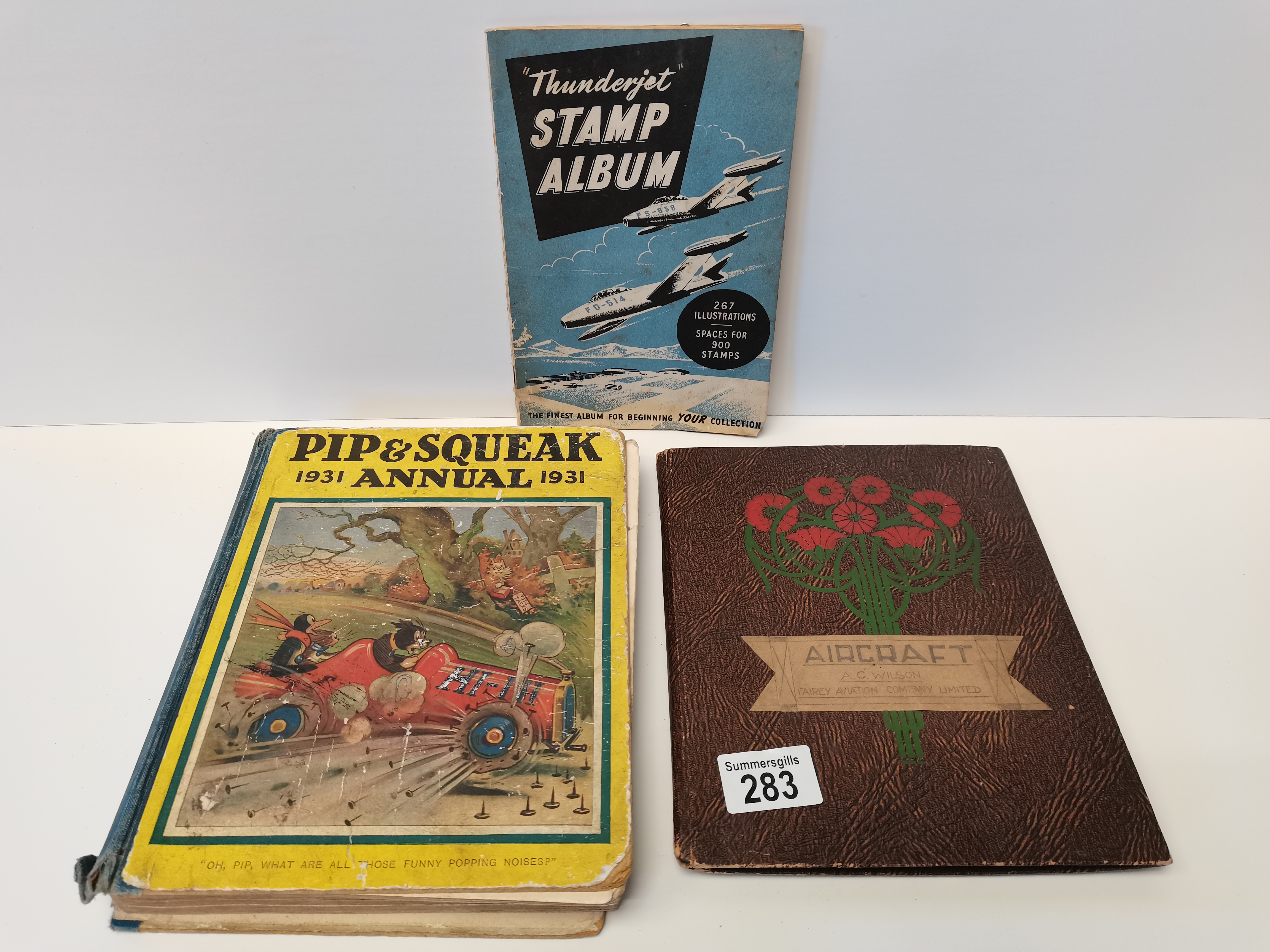 A collection of aircraft cigarette cards, Thunderjet stamp album and 1931 Pip & Squeak annual