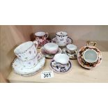 A collection of miniatures cups/saucers incl crown derby