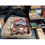 A large collection of costume beads and oriental jewellery box