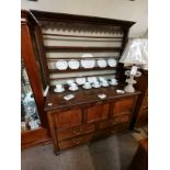 Early Antique dark oak dresser with lift up top and brass handles.