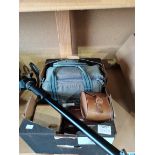 A Box Containing Cameras and Camera Equipment