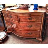 Bow fronted mahogany chest of drawers with fretwork to the sides.