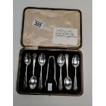 A set of 6 Silver teaspoons and sugar tongs in original presentation box