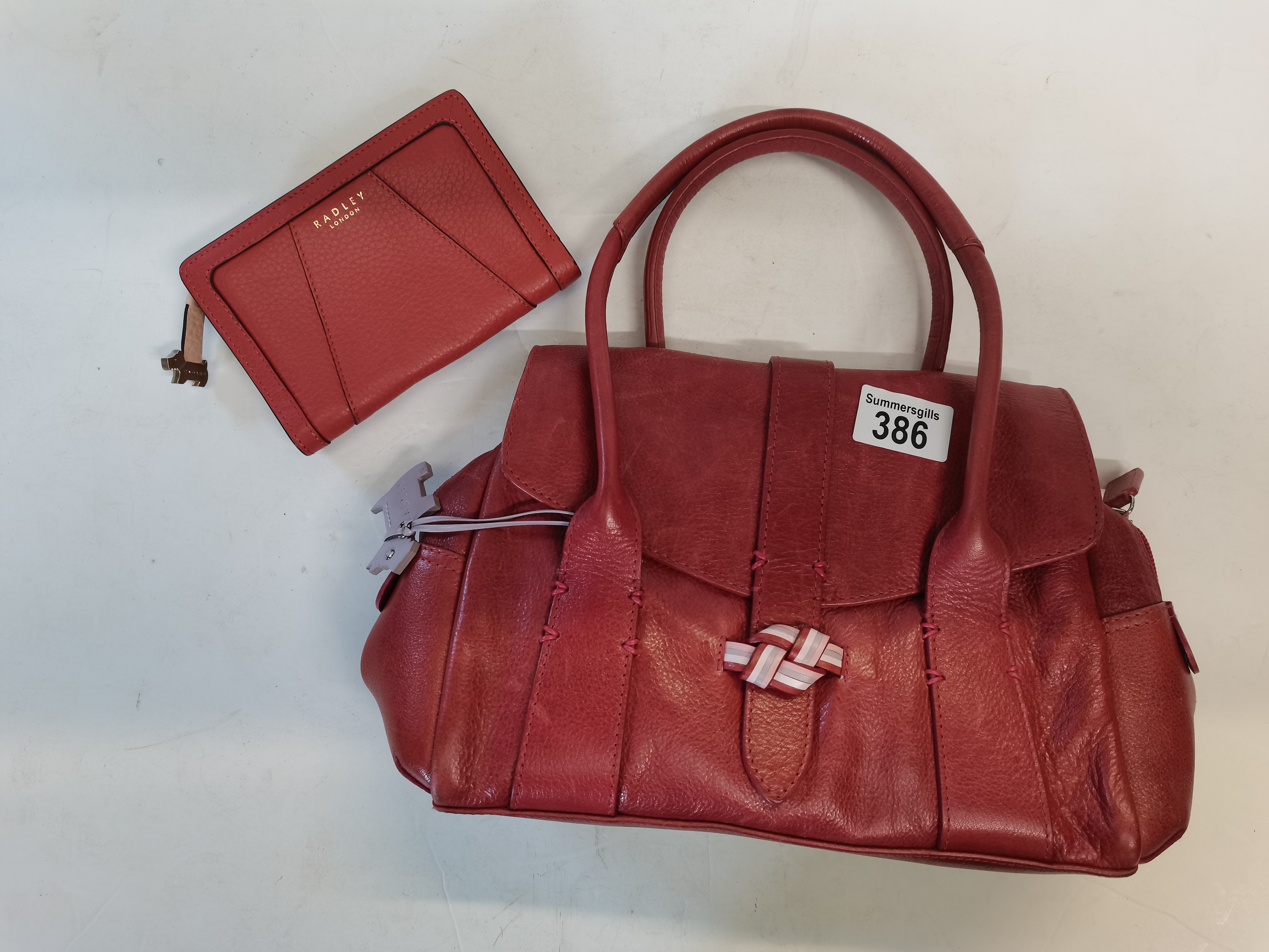 Rust coloured Radley handbag with pink stitching