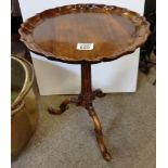 A mahogany side tables with decorative stem and ex