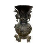 A CHINESE BRONZE VASE OF ARCHAISTIC DESIGN with double handles in the form of birds, the bulbous