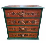 A 19TH CENTURY CONTINENTAL DECORATIVE PAINTED PINE CHEST OF FOUR DRAWERS Applied with knob