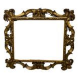 A 17TH/18TH CENTURY ITALIAN CARVED GILTWOOD FLORENTINE FRAME. (rebate 65.5cm x 80.5cm, overall 111.