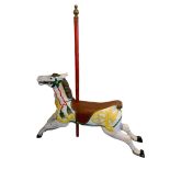 A LARGE DECORATIVE VINTAGE WICKSTEAD PAINTED FIBERGLASS CAROUSEL HORSE. (h 102.5cm x d 30cm x w