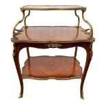 A 19TH CENTURY FRENCH LOUIS XV GILT BRONZE KINGWOOD AND ROSEWOOD SERPENTINE THREE TIER ETAGERE