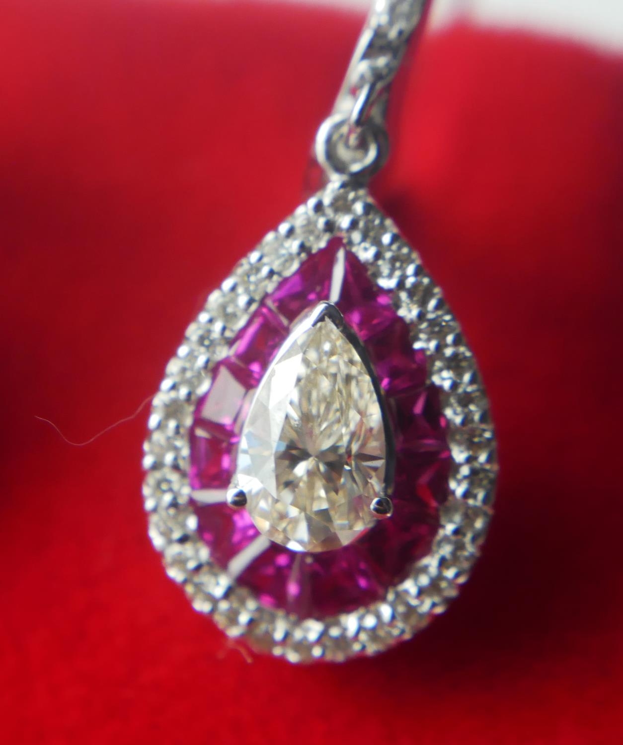 A PAIR OF 18CT WHITE GOLD, RUBY AND DIAMOND DROP EARRINGS Set with a central pear shape diamond - Image 2 of 2