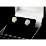 A PAIR OF ETHIOPIAN OPAL AND SILVER STUDS.