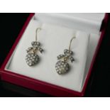 A PAIR OF HEART DROP EARRINGS WITH BOW TOPS SET WITH DIAMONDS AND SEED PEARLS.