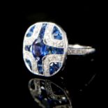 AN ART DECO STYLE PLATINUM, SAPPHIRE AND DIAMOND PANEL RING Boxed. (Size N)