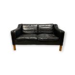 A 20TH CENTURY DANISH BLACK LEATHER TWO SEATER SOFA Raised on square legs. (h 75.5cm x d 77.5cm x