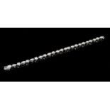 AN 18CT WHITE GOLD AND DIAMOND LINE BRACELET Set with alternate round brilliant cut and marquise cut