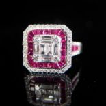 AN 18CT WHITE GOLD, RUBY AND DIAMOND RING Set with tapered baguette and princess cut rubies and