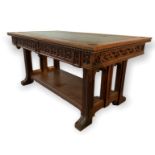 A 19TH CENTURY OAK GOTHIC REVIVAL TWO DRAWER FREESTANDING LIBRARY TABLE