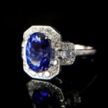 AN 18CT WHITE GOLD, AAA TANZANITE AND DIAMOND CLUSTER RING. (Tanzanite 3.38ct. Diamonds 0.68ct,