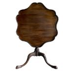 A GEORGE III MAHOGANY TRIPOD TEA TABLE The shaped top with pierced gallery above a turned column,