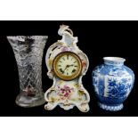 AN EARLY 20TH CENTURY POTTERY CASED MANTLE CLOCK Along with a Japanese vase and a cut glass vase.