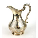 A VICTORIAN SILVER BULBOUS CREAM JUG With single scroll handle and engraved cartouche decoration,