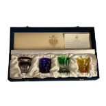 FABERGÉ, A RUSSIAN SET OF FOUR VODKA GLASSES Titled 'Na Zdorovye', four overlaid glasses, each