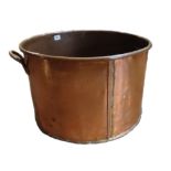 A LARGE 19TH CENTURY HEAVY GAUGE LACQUERED COPPER COOKING POT With two brass carrying handles. (