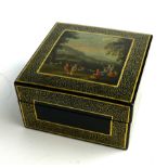 A 20TH CENTURY PAPIER-MACHÉ SQUARE TRINKET BOX With wide gilt border and hand painted landscape to