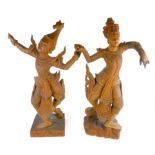 TWO LARGE EARLY 20TH CENTURY CARVED WOODEN STATUES, BALINESE DANCERS. (64cm) Condition: good, age