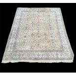 A LARGE ZIEGLER RUG With floral field on a beige ground. (356cm x 267cm) Condition: good overall