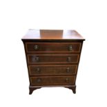 A REGENCY STYLE MAHOGANY AND SATINWOOD BANDED CHEST OF FOUR LONG DRAWERS Fitted with brass loop