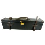 A VINTAGE BLACK LEATHER RECTANGULAR GUN CASE With brown leather straps, brass lock and fitted