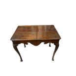 AN 18TH CENTURY IRISH MAHOGANY SILVER TABLE with dished top above a shaped apron on acanthus