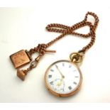 AN EARLY 20TH CENTURY 9CT GOLD GENT'S POCKET WATCH AND ALBERT CHAIN The open faced pocket watch with